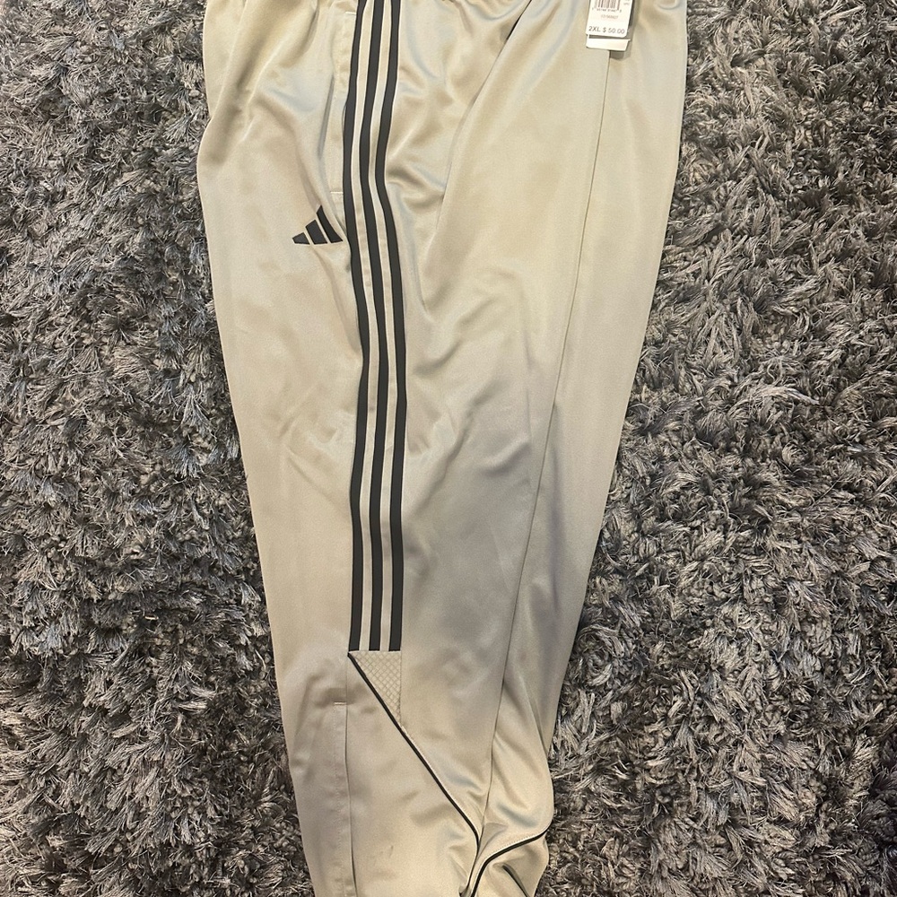 Adidas Tan and Black Sweatpants with Iconic Stripes